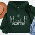 This hoodie Features a laid-back campsite logo, it’s made for folks who think burnt marshmallows are gourmet, tents are luxury suites, and every log is a potential chair.